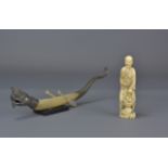 A 19th Century Japanese ivory figure of a man with