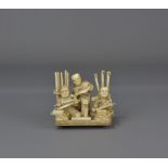 A 19th Century ivory carving of 3 pipe makers