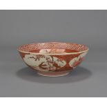 A Japanese Kutani bowl painted with a group of sch