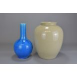 A decorative 20th Century blue glazed bottle vase