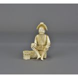 A 19th Century seated figure of a farmer with red