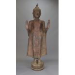 A large standing bronze Thai Buddha