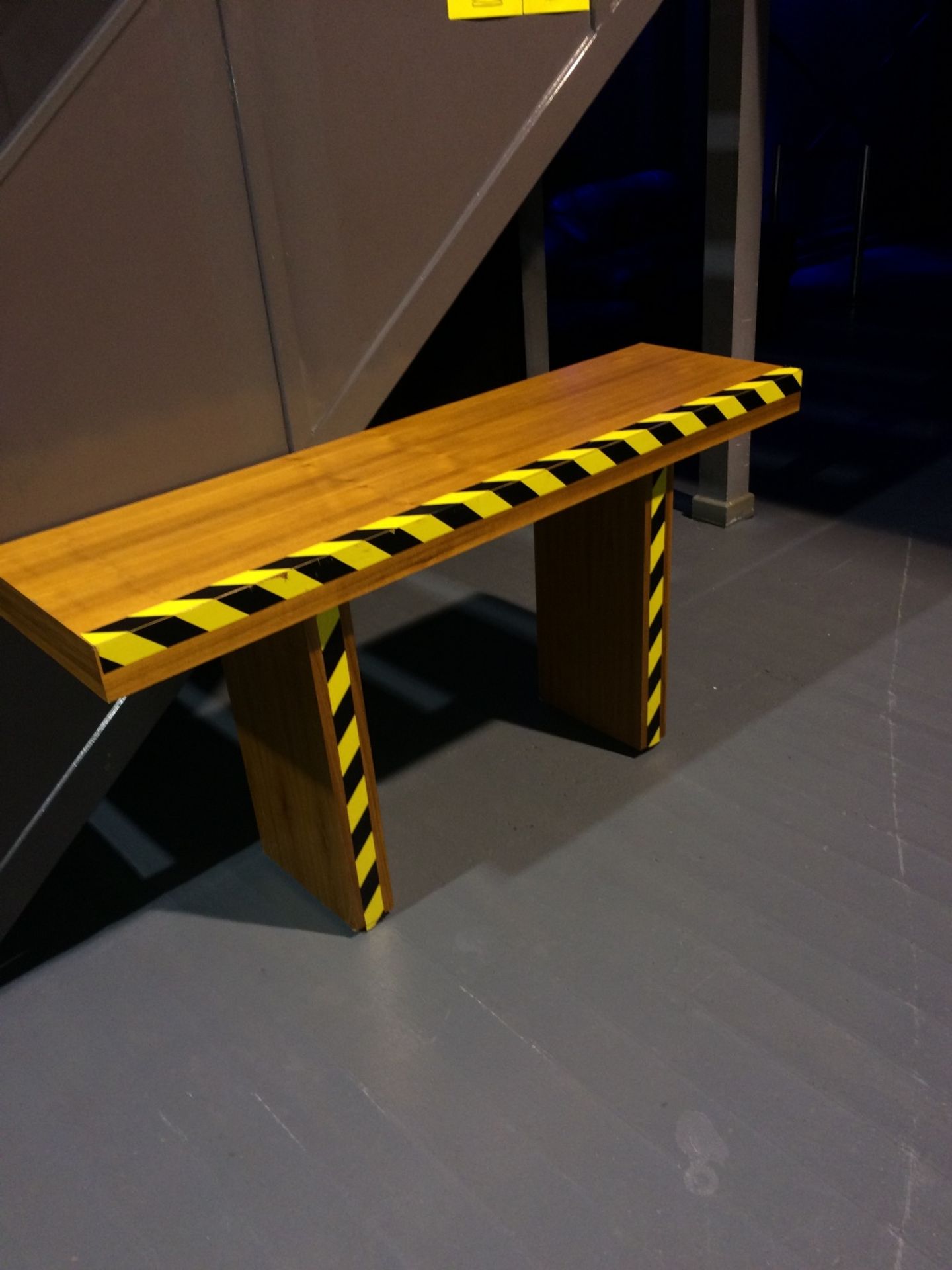 Wood Table Yellow And Black Tape Is Easily Removable - Image 2 of 4