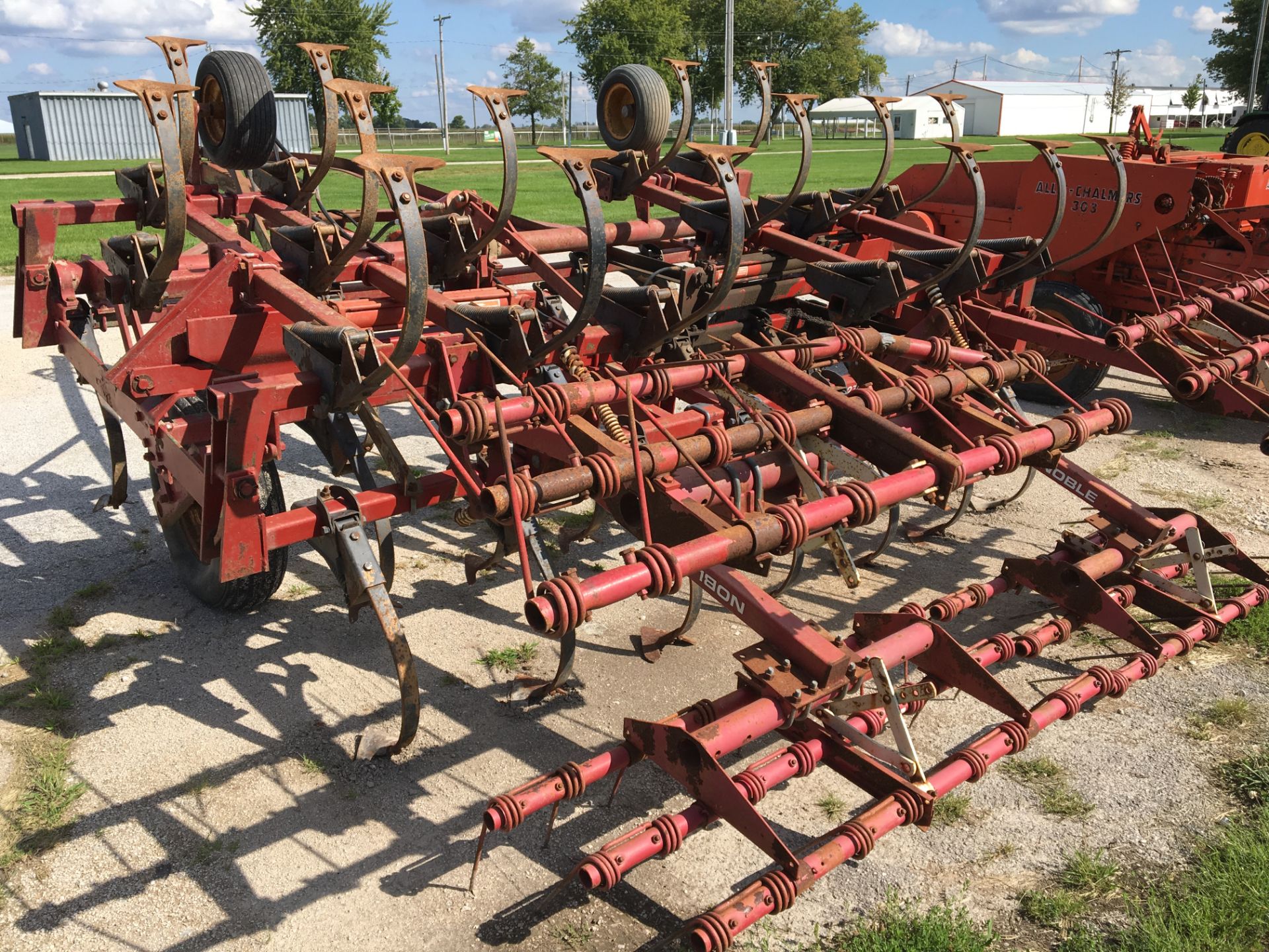 Kewanee 270 Super Shank 20' field cultivator with 3 bar coil tine harrow.