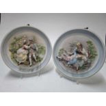 Twee ronde porseleinen wandborden, diameter ca 30 cm Two decoratif porcelain plates, diameter 30cm.