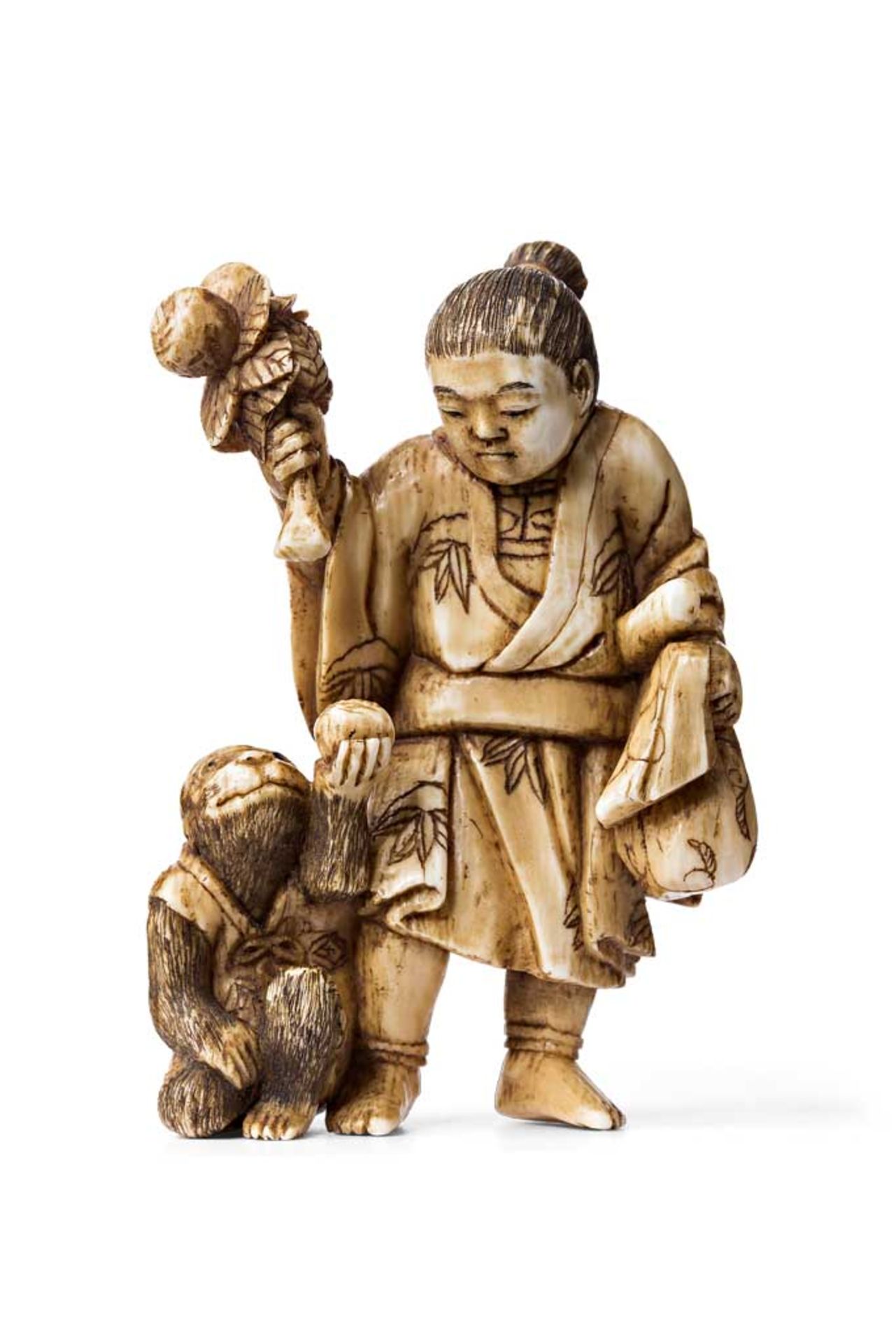 Netsuke. Momotaro füttert einen Affen mit Kloß. Elfenbein. Meiji-Zeit. H 6 cm