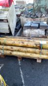 Pallet of Rounded Fence Posts.