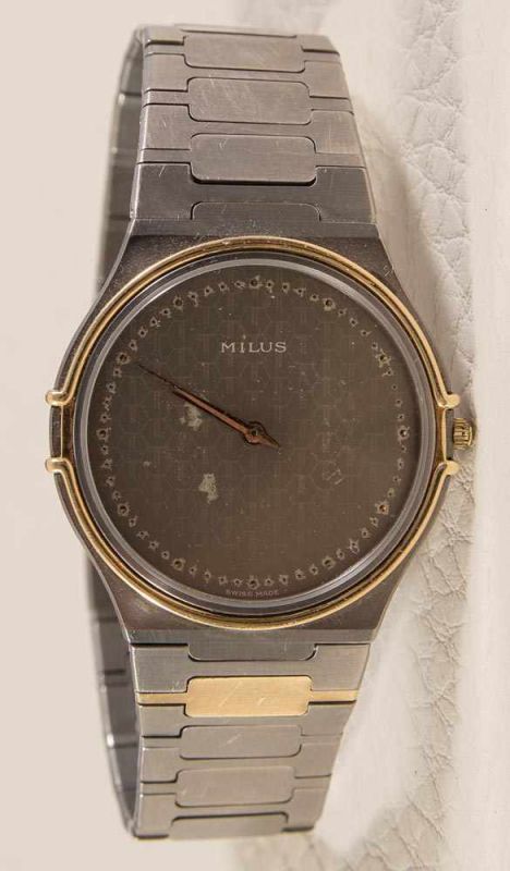 "Milus" Titan & gold Herrenarmbanduhr, 1980er/90er Jahre. Modell "Titan & Gold". Saphirglas. No