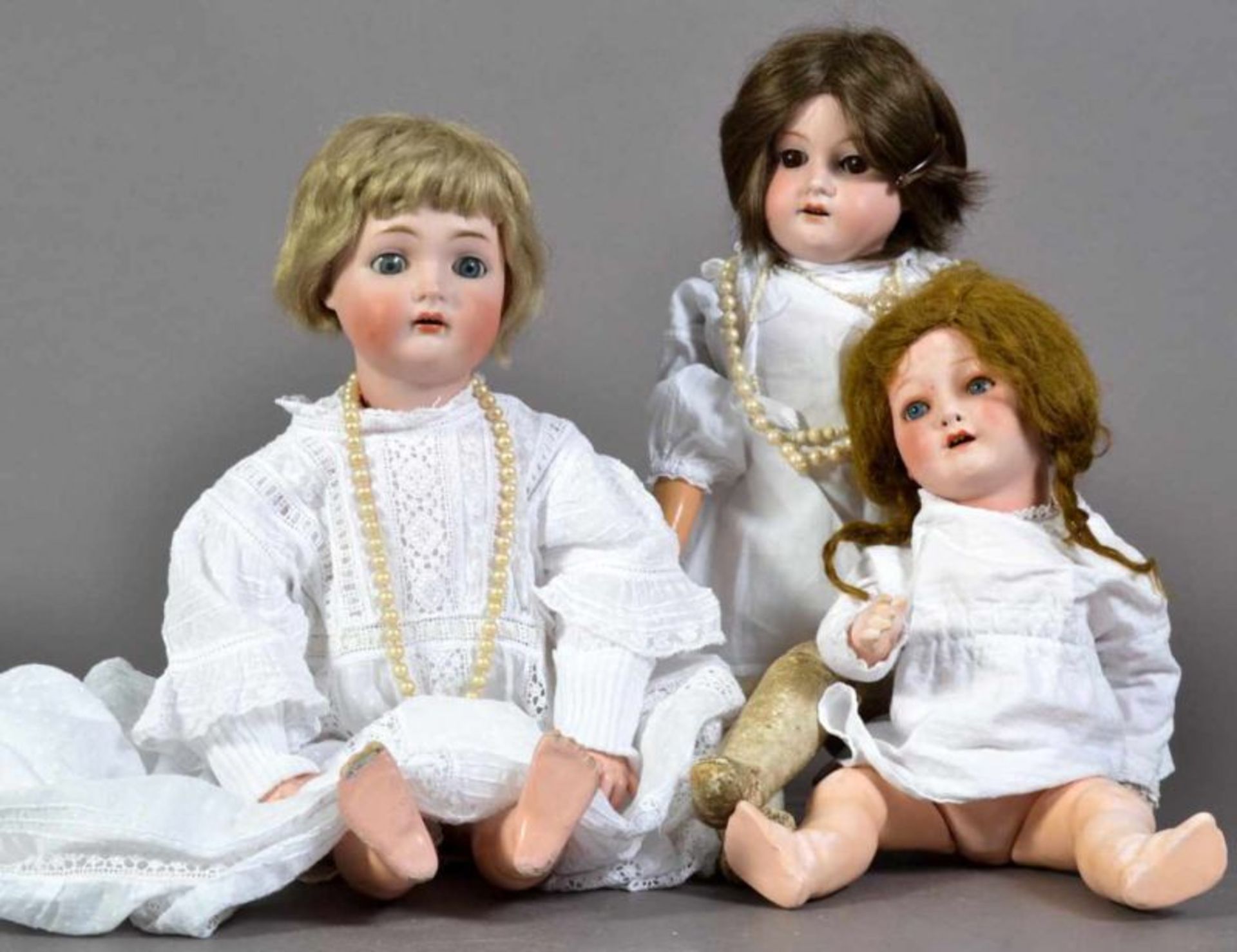 3teiliges Konvolut "alte & antike Puppen" alle mit Porzellankopf u. a. Heubach & Armand -