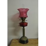 COLLECTABLES - A stunning antique oil lamp on blac