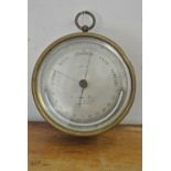 COLLECTABLES - An antique circular brass barometer