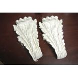 COLLECTABLES - A pair of plaster cast decorative corbels, each measuring 31cm tall.