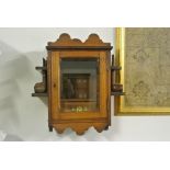 COLLECTABLES - An antique oak smokers cabinet with