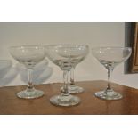 CERAMICS/ GLASS - A collection of 4 champagne saucers.