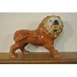 CERAMICS - A large antique style ceramic lion, mea