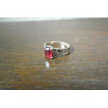 GOLD/ JEWELLERY - A 9ct gold & red stone ring, wit