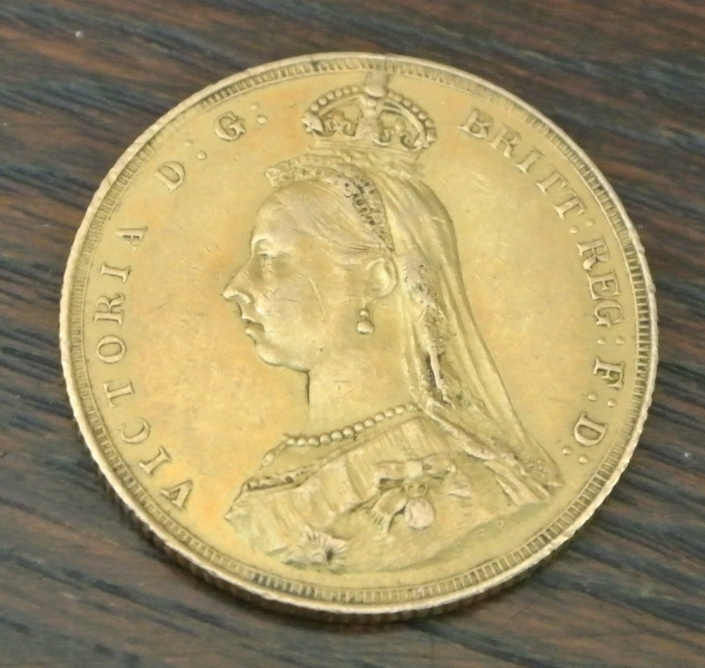 COINS - An 1887 Victorian Sovereign coin.