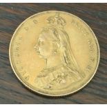 COINS - An 1887 Victorian Sovereign coin.