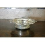 SILVER - An antique sterling silver pierced dish,