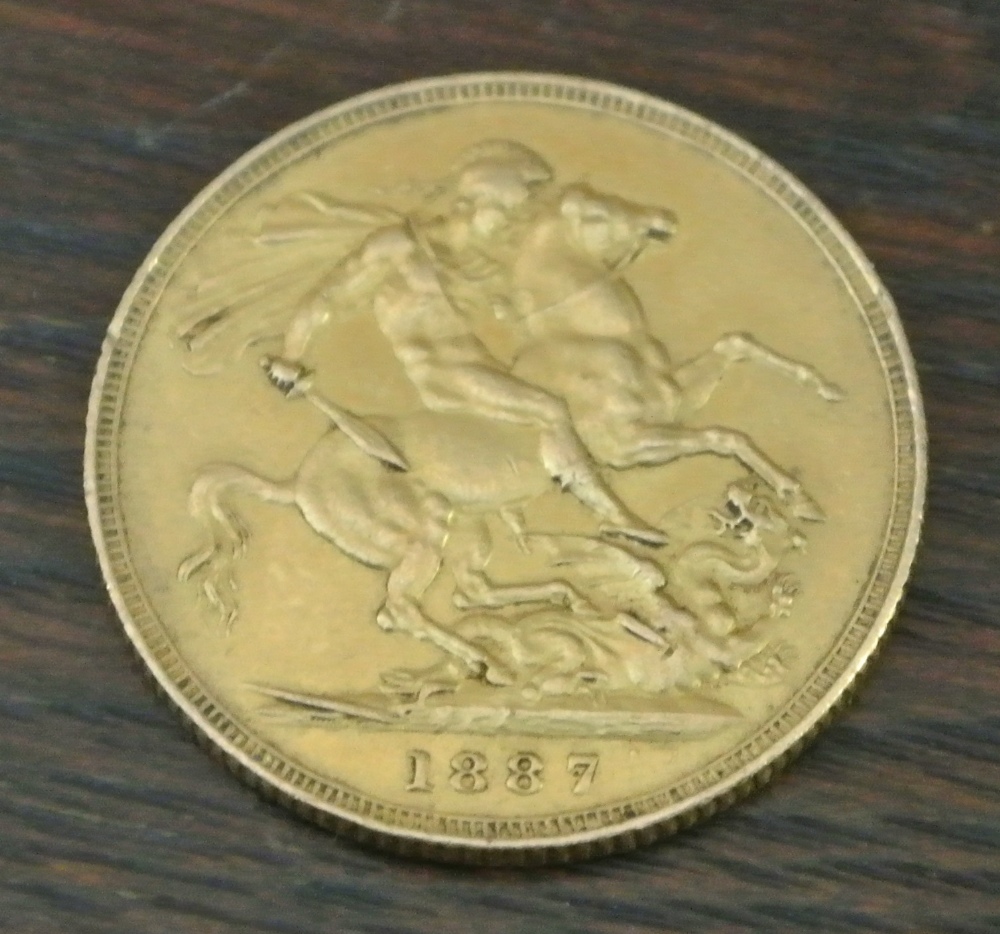 COINS - An 1887 Victorian Sovereign coin. - Image 2 of 2