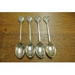 COLLECTABLES - A collection of 4 white metal teasp