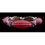 An attractive diamond 18ct gold and coral coloured bracelet, designed as a series of five fluted