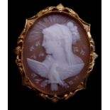 An antique yellow gold and shell cameo brooch, c1860, the oval cameo finely carved with Clytie in