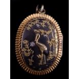 An antique Shakudo locked pendant, c1880, designed as two very fine oval Shakudo plaques,