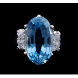 An aquamarine and diamond dress ring, the oval shaped mixed cut aquamarine weighing 8.47ct of good