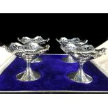 A cased set of four silver sweetmeat dishes, circular footed form, Birmingham 1924, makers mark SB&S