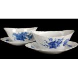 A pair of Royal Copenhagen porcelain sugar bowls with integral under dishes, blue flowers curved