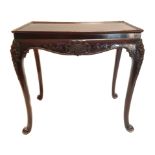 A fine carved mahogany centre table probably Irish, 18/19thC, the rectangular dished top with