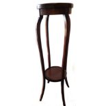 A tall mahogany Edwardian plant stand, with boxwood stringing, circular top and undertier, 1m high