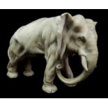 A Royal Dux porcelain figure of an elephant, impressed 1087, 12cm high