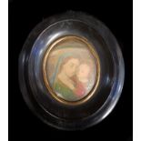 A framed miniature watercolour of The Madonna and Child, oval wooden frame with gilded metal insert,