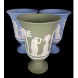 Three Wedgwood jasper ware shape 71 vases, two blue and one green, sprigged with classical scenes,