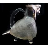 A Victorian silver mounted claret jug, the silver formed as a sphinx head and a bird tail, the cut