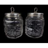 A pair of Walker & Hall silver topped cut glass preserve jars, the silver with egg and dart