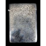 A Walker & Hall silver card case, rectangular with flip top cover, engraved with scrolling