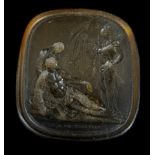 A Marchant Intaglio amber glass seal, cast with the death of a classical warrior, rounded