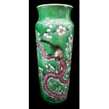 A Chinese famille verte porcelain sleeve vase, decorated with a bird amid flowering prunus branches,