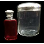 A silver flip top perfume bottle, the glass body of cranberry colour, Birmingham 1912, makers mark