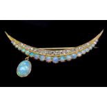 An opal and diamond crescent moon form brooch, set in 15ct yellow gold, the stones arranged in two