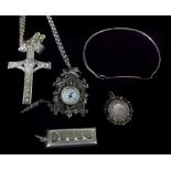 A Japanese marcasite brooch pendant, in the form of a cuckoo clock, modern quartz movement with