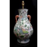 A Chinese porcelain two handled vase of squat baluster form with elephant head form handles