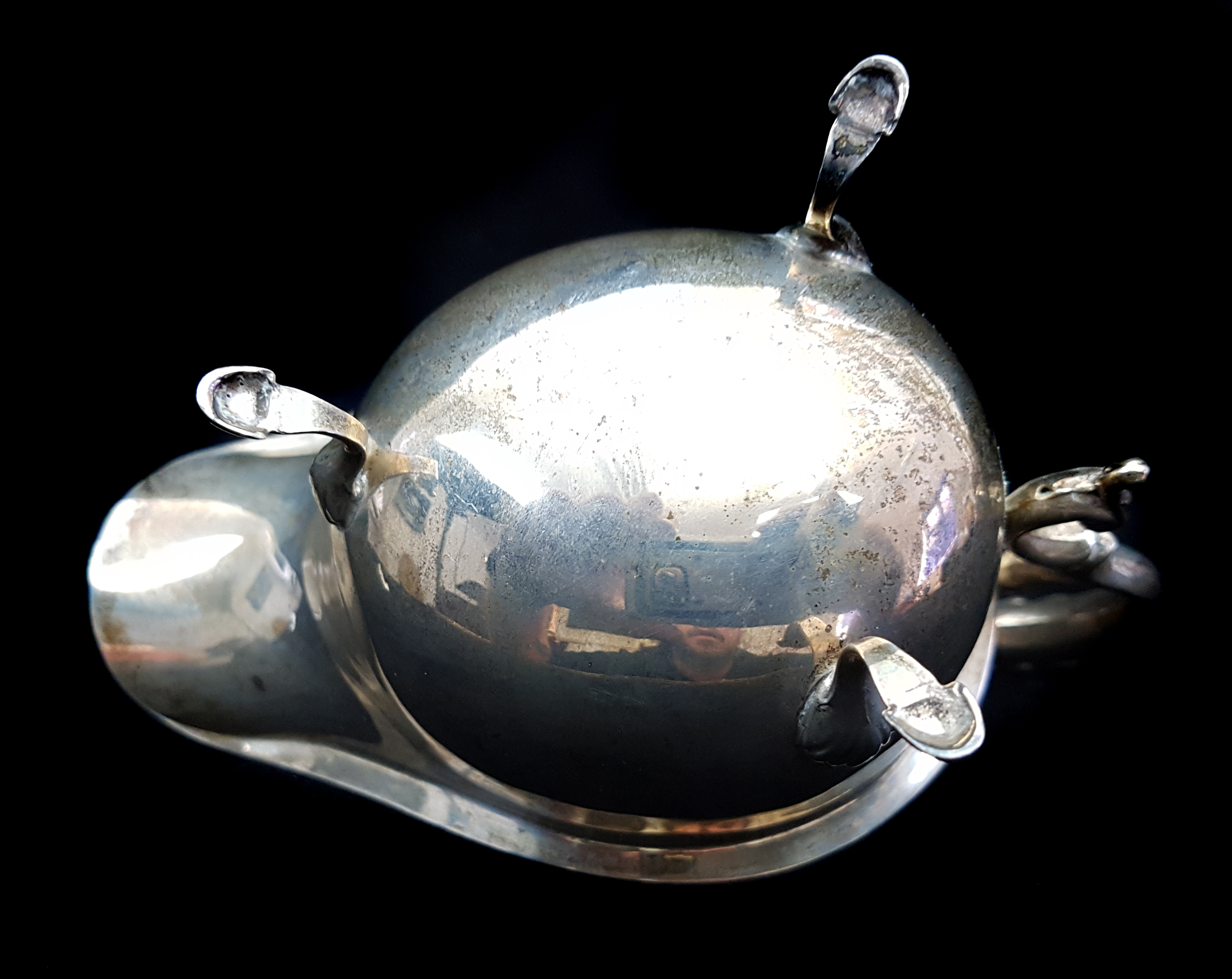 A silver sauceboat, on three volute feet with 'c' scroll handle, Birmingham 1935, kings & queens - Image 2 of 3