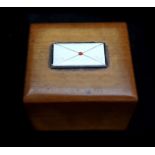 A Treen boxwood stamp box, the hinged cover applied with an enamel envelope with red wax seal, 4 x