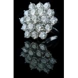 A diamond cluster ring, of nineteen round brilliant cut diamonds of 3.9mm-4.7mm, claw and grain set,