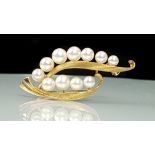 A pearl and 14k yellow gold brooch, formed as stylised Lily of the Valley spray, stamped 14k 5cm