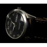 A Timex perpetual calendar wristwatch. Stainless steel, black dial with rectangular day and date